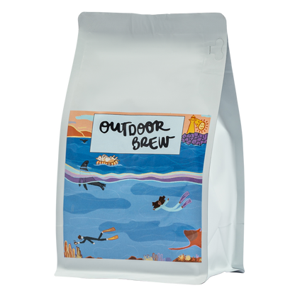 Coffee bag with 'Outdoor Brew' label featuring a scenic underwater design of a dark harbour. for our single origin sumatran coffee bean